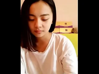 Young Asian teen showing say no to smooth circle